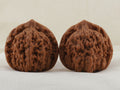 Official’s Hat walnut pair, 48 mm — WW-00004, hero view.