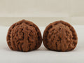 White Lion Head walnut pair, 36 mm — WW-00016, hero view.