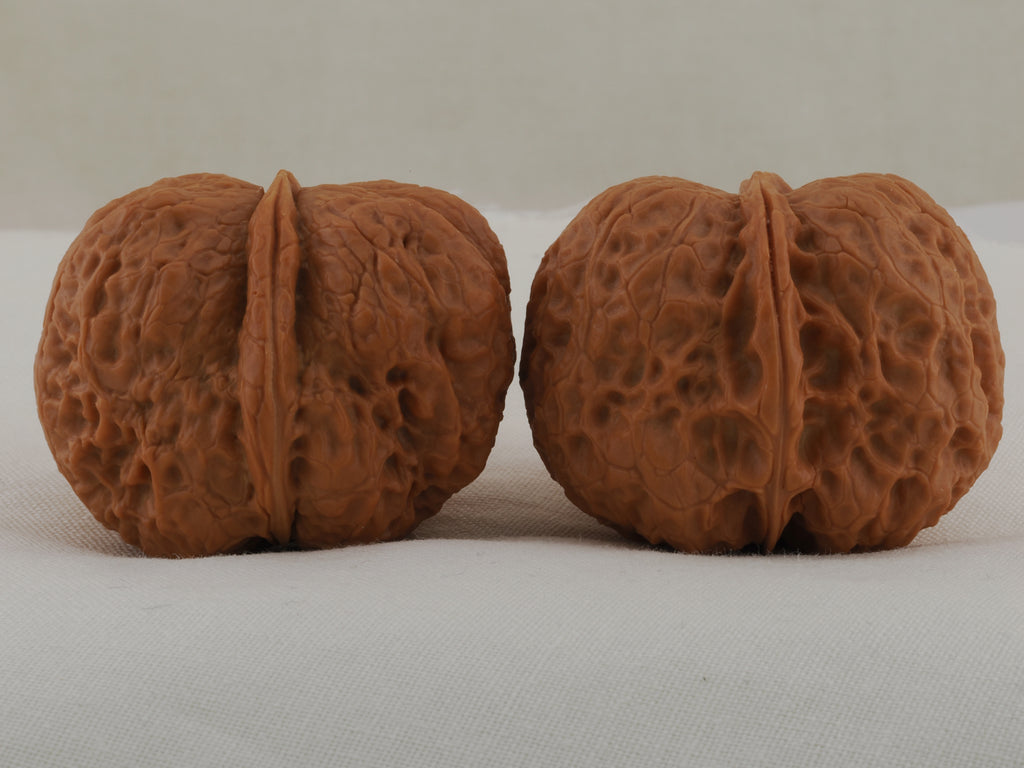 Iron Ingot walnut pair, 38 mm — WW-00029, hero view.