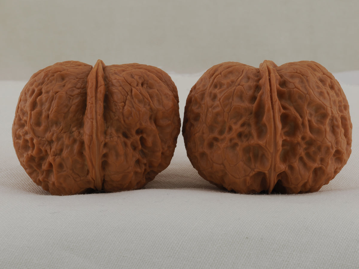 Iron Ingot walnut pair, 38 mm — WW-00029, hero view.