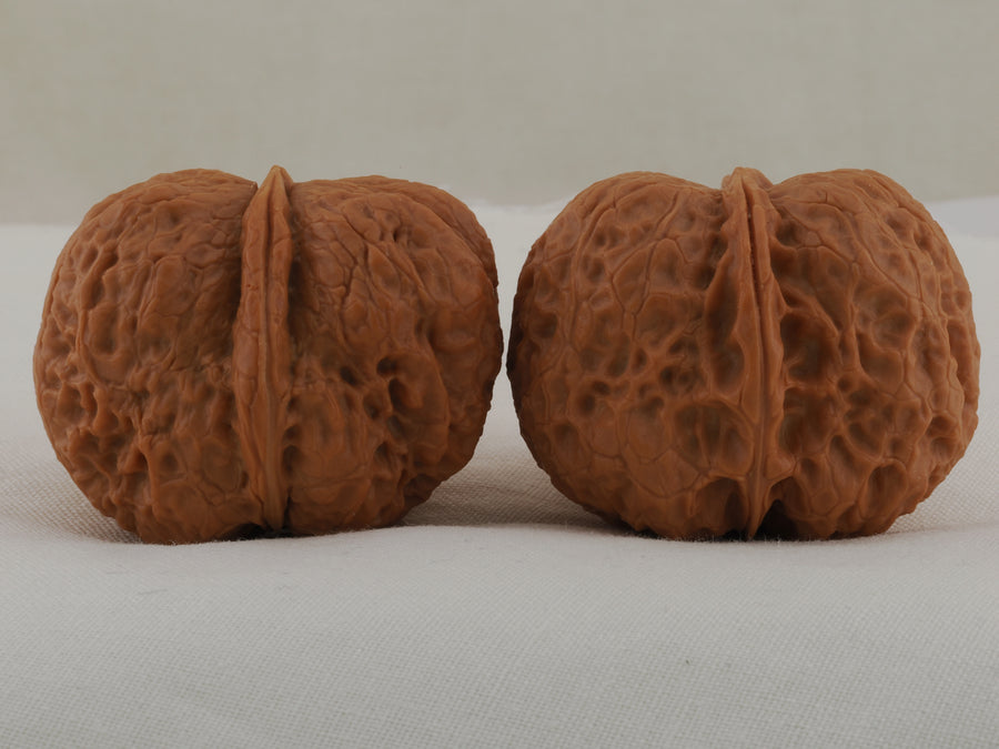 Iron Ingot walnut pair, 38 mm — WW-00029, hero view.